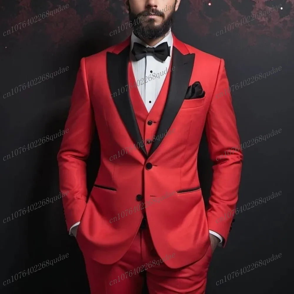 A man wears a red three-piece tuxedo with a black shawl collar, black bowtie, and white shirt.