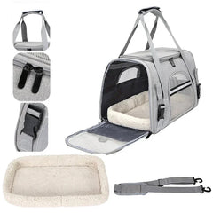 A grey soft-sided pet carrier with mesh windows, a removable fleece cushion, and a shoulder strap.