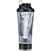 A portable electric protein shaker cup with a black lid and base, showing a water vortex inside.