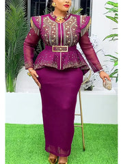 A woman wears a purple two-piece set featuring a beaded peplum top with fringe and a long skirt.