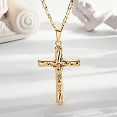 A 14K gold-plated crucifix pendant hangs from a matching figaro chain.