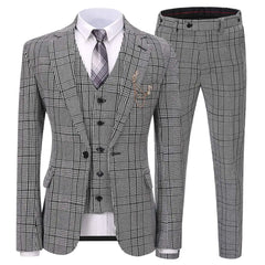 A three-piece grey houndstooth suit featuring a single-button jacket, vest, and matching trousers.