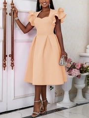 A peach knee-length A-line dress featuring a sweetheart neckline and ruffled flying sleeves.