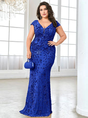 A plus-size woman wears a floor-length, blue mermaid evening gown with sequins and a V-neck.