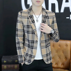 A man wears a tan and black plaid slim-fit blazer with a single-button closure.
