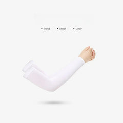 A pair of white cooling arm sleeves worn on a person's arms against a plain background.