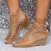 Gold glittery wedge sandals with a hollow fishnet design and peep-toe front.