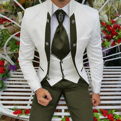 A man wears a white patterned tuxedo jacket with olive green lapels, vest, and trousers.