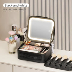 A black travel makeup case with an integrated LED mirror and adjustable interior dividers.