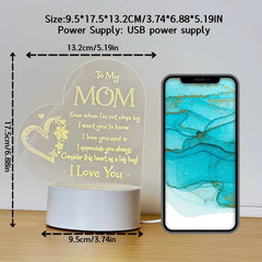 A heart-shaped acrylic night light for mom with engraved text and a USB power base.