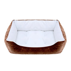 A rectangular pet bed with brown plush exterior walls and a soft white cushioned interior.