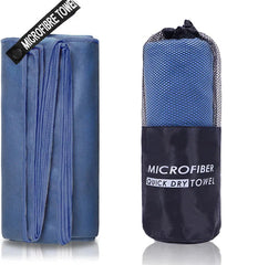A blue microfiber sports towel shown both unfolded and packed inside a mesh carrying bag.