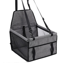 A grey, foldable pet car seat with mesh sides and adjustable straps for securing in a vehicle.