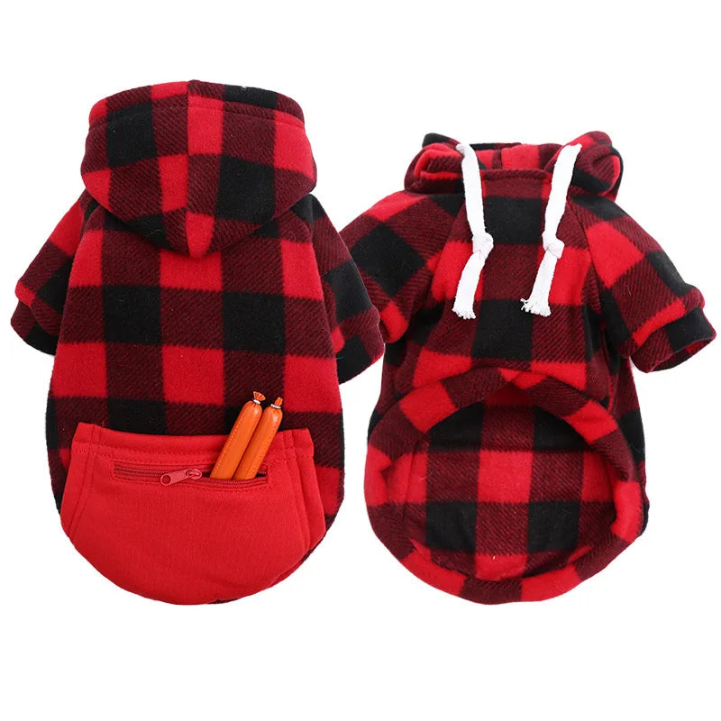 A red and black plaid dog hoodie featuring a functional pocket with two toy sausages inside.