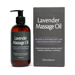 A bottle of lavender massage oil stands next to its matching dark gray product box.