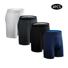 A set of four men's long-leg cotton boxer shorts in grey, charcoal, black, and navy blue.