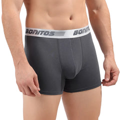 A man wearing dark grey cotton boxer shorts with a white branded elastic waistband.