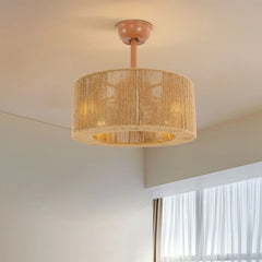 A round ceiling fan light with a tan rope-wrapped drum shade hanging from a light brown mount.
