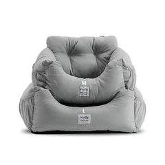 A gray, cushioned pet booster seat for cars with two sizes labeled M and L.