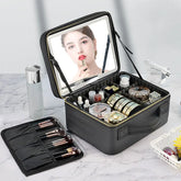 A black travel makeup case with an integrated LED mirror and adjustable interior compartments.