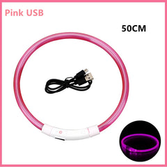 A pink USB rechargeable LED glowing collar for pets shown with its charging cable.