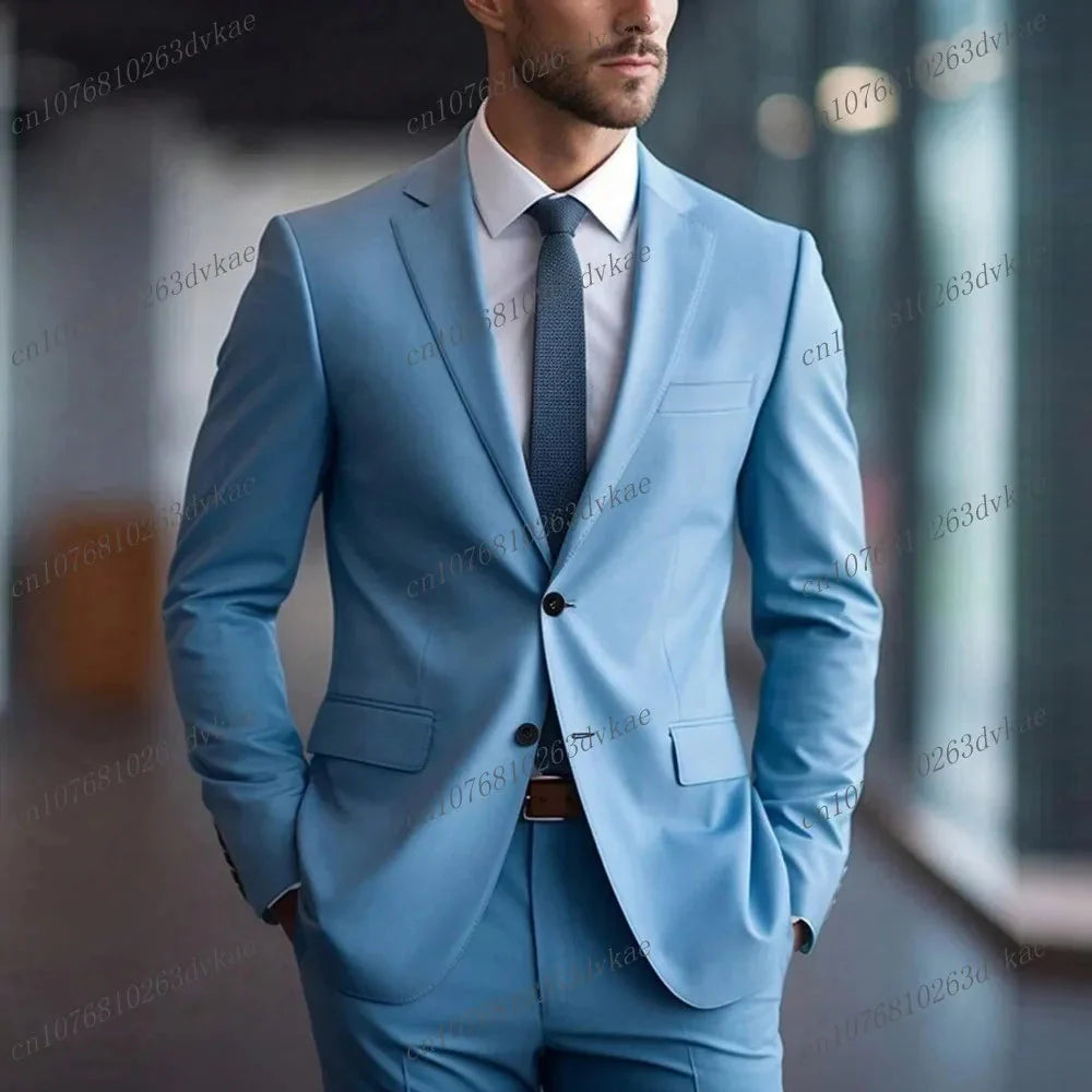 A man wears a light blue two-piece formal suit with a white shirt and a dark tie.