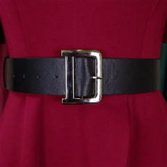 A wide black belt with a large silver D-shaped buckle worn over a solid red dress.