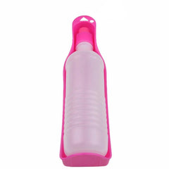 A portable pink plastic pet water bottle with an integrated drinking bowl for travel.