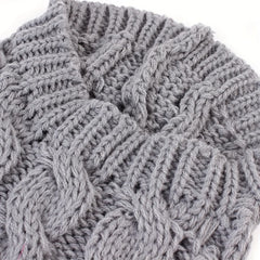 A grey knitted sweater for pets featuring a textured cable knit pattern.