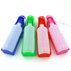 Four portable pet water bottles with attached drinking trays in blue, green, red, and pink.
