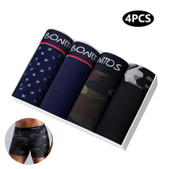 A set of four men's cotton boxer shorts in various patterns including airplane print and camouflage.