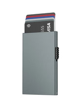 A slim, grey metal RFID-blocking card holder with a pop-up mechanism displaying several cards.