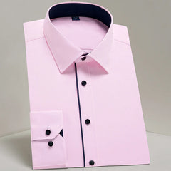 A light pink long-sleeve dress shirt with dark blue contrasting trim and buttons.