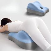 A blue and grey memory foam wedge pillow designed for stomach sleeping support.