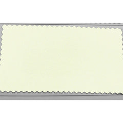 A rectangular swatch of light cream-colored fabric with pinked, zigzag-cut edges.