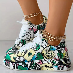 Women's thick-soled sneakers featuring a colorful hand-painted graffiti print with playing cards.