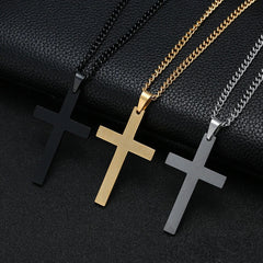 Three stainless steel cross pendant necklaces in black, gold, and silver on matching link chains.