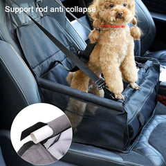 A small dog stands in a black, foldable nylon pet car seat secured to a vehicle seat.