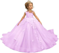 A young girl wears a floor-length lavender tulle ball gown decorated with 3D butterfly appliques.