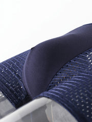 A close-up of a dark blue ice silk boxer brief featuring a breathable mesh fabric texture.