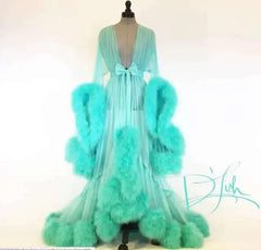 Deep V-neck tulle maternity dress with lace hollow details, long sleeves, feather accents, perfect for photoshoots and special occasions.