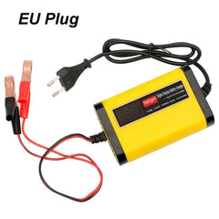 A yellow and black automatic car battery charger with an EU plug and red and black alligator clips.