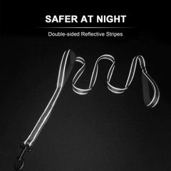 A black nylon dog leash with double-sided reflective stripes against a dark background.