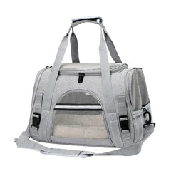A grey, soft-sided pet carrier bag with mesh ventilation panels and an adjustable shoulder strap.