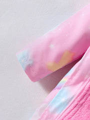 A close-up of a pink children's winter coat featuring a pastel unicorn and star pattern.