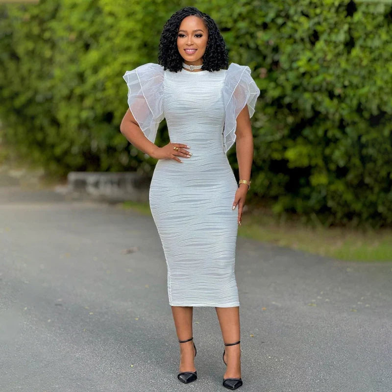 A woman wears a white midi bodycon dress with ruffled butterfly sleeves and a textured finish.