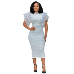 A woman wears a white midi bodycon dress with ruffled butterfly sleeves and a textured finish.