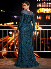 A woman wears a floor-length, teal mermaid evening dress with long sleeves and sequin detailing.