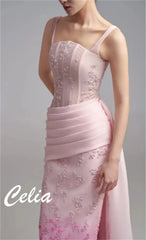 A sleeveless pink evening gown with a corset bodice, floral embroidery, and a pleated waist.