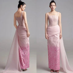A model wears a floor-length pink satin evening gown with a pleated waist and floral embroidery.